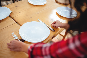 Close up photo of woman holding cutlery