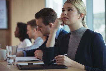 Thoughtful businesswoman at desk