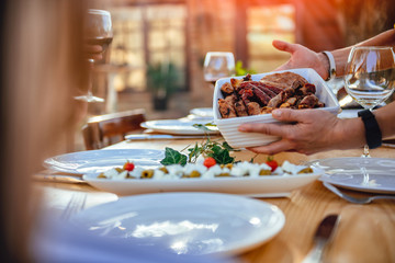 Women serving barbecued meat