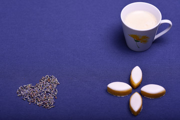 French calissons with a cup of coffee and lavender heart.