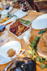 Served barbecue meat at dining table