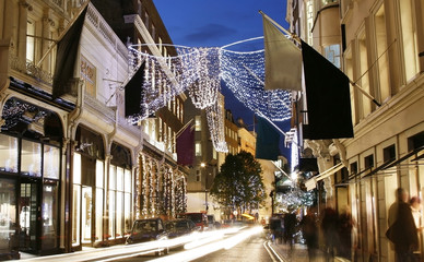 UK - Cities - Christmas Shopping Street in London, motion blurred people present.