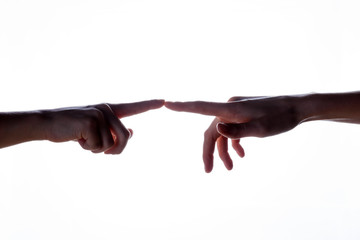 Isolated image of a silhouette of the boy's hands reaching for the woman's hand. Hands of mother and son. The concept of family, support, help, love.