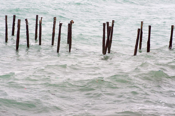 Old rusty berths in the sea destroy the ecology
