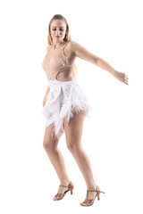 Naklejka premium Profile view of skillful female dancer in professional dance costume outfit smiling. Full body length portrait isolated on white background.