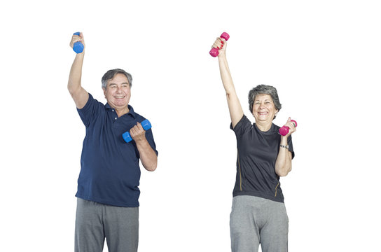 Two senior people in a gym class doing Pilates exercise lift weights over a white background