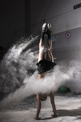 Obraz premium Young caucasian woman doing yoga at gym