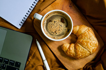 Coffee cup hot and croissant 