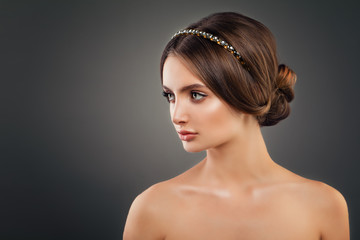 Beautiful Young Woman Fashion Model with Wedding Hairstyle, Makeup and Golden Hair Decor