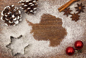 Festive motif of flour in the shape of Antarctica (series)