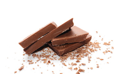 Milk chocolate bars, pieces with shavings isolated on white background