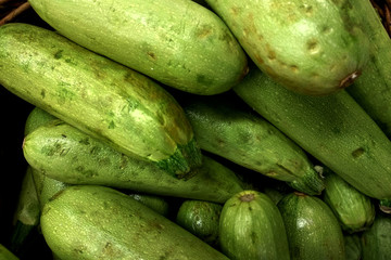 Vegetables and fruits lie on the counter in the store.