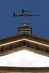 crucifix and birds on blue sky