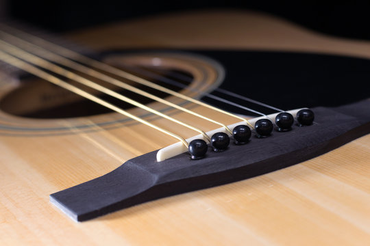 Parts of acoustic guitar close-up