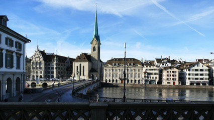 Beautiful view of the historic city center of Zurich with famous .Fraumunster Church and the on river Limmat on a .autumn day with blue sky, Canton of Zurich, Switzerland