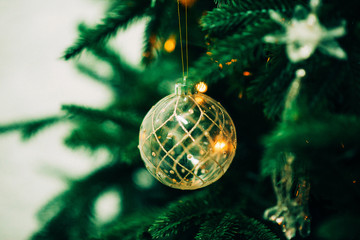 Closeup of Green Christmas tree and pink ball decorations