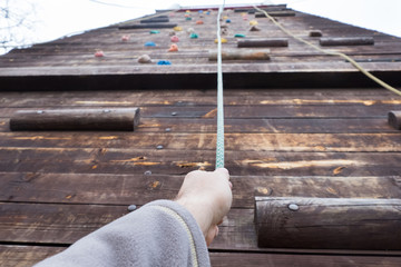 Obraz na płótnie Canvas climbing wood wall at safety adventure park
