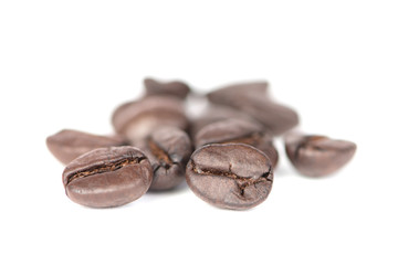 Closed up coffee beans on white