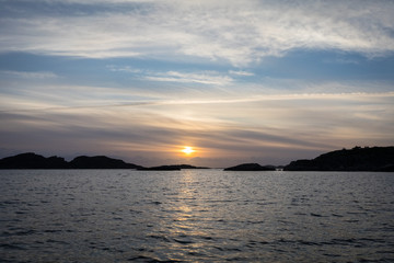 Fototapeta premium Sun is setting over the archipelago, Kristiansand Norway