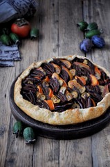 Galetta. Open fruit cake with a feijoa, persimmon, plum