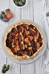 Galetta. Open fruit cake with a feijoa, persimmon, plum