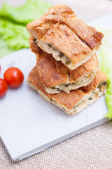 Pie with meat and fresh vegetables on plate 