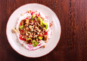 Brussels with cottage cheese, pomegranate and nut salad