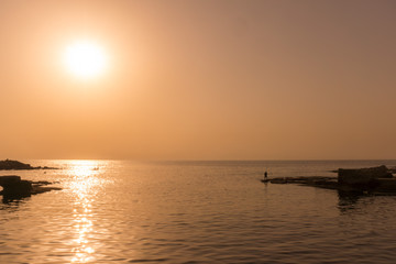Fototapeta na wymiar Sunset along the coast of Lebanon with reflection on the ocean