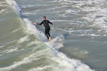 A surfer at Newport Beach, California.