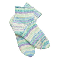 pair of winter homemade knitted socks isolated on white background