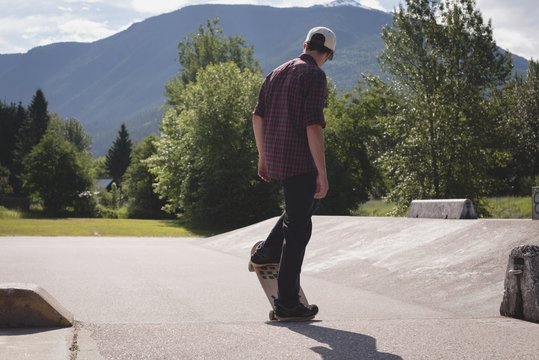 Man skateboarding on the road