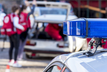 police and ambulance at the place of a traffic accident