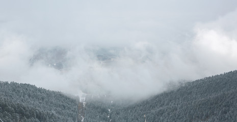 Panorama of the foggy winter landscape in the mountains