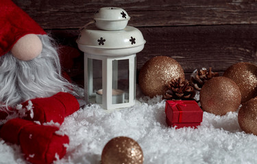 Christmas white candle lantern with Xmas dwarf background.
