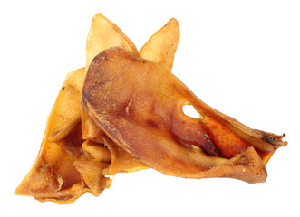 Group of dried pigs ears dog chew treats isolated on a white background