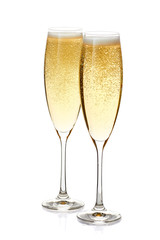 Two glasses of champagne with foam and bubbles on white