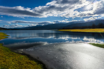 Panoramic view of frozen waters of  Plastira lake in winter in Tikala, central Greece