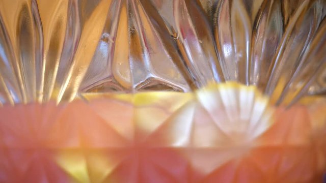 A Punch Bowl As Seen Through Exterior Glass Being Stirred