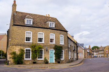 Empty English residential street with row of restored traditional British Victorian houses - 182092188