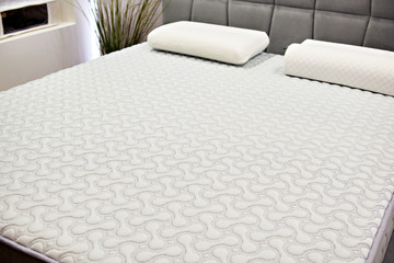 White mattress on double bed