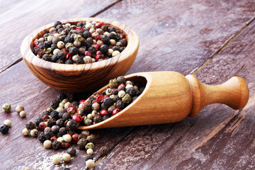 Colorful Peppers Mix in wooden scoop and bowl.