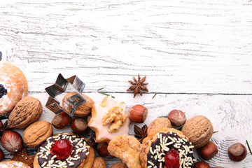 Christmas border. Xmas Gingerbread cookies, spices and decorations on wooden background