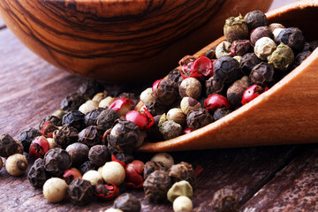 Colorful Peppers Mix in wooden scoop and bowl.