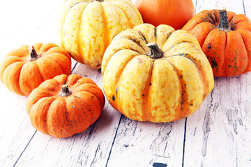 Many orange pumpkins on wooden background, Halloween concept.
