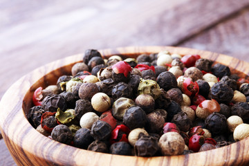 Colorful Peppers Mix in wooden scoop and bowl.