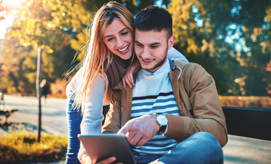 Couple in love enjoying in moments of happiness in the autumn park. Love, relationships, fashion, lifestyle
