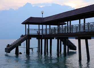 pier on pilars with staircases at the blue hour in malaysia