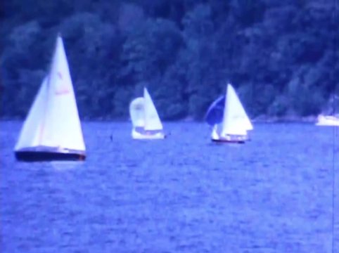 Sailboats sail up the Connecticut river during summer race in 1965