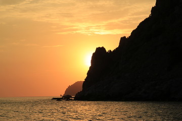 Beautiful sunset, rocky coast of Cape Fiolent. Dramatic scene. Crimea