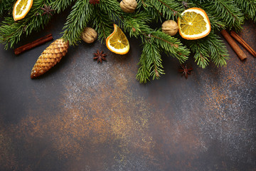 Dark brown christmas background with fir branches .Top view with copy space.